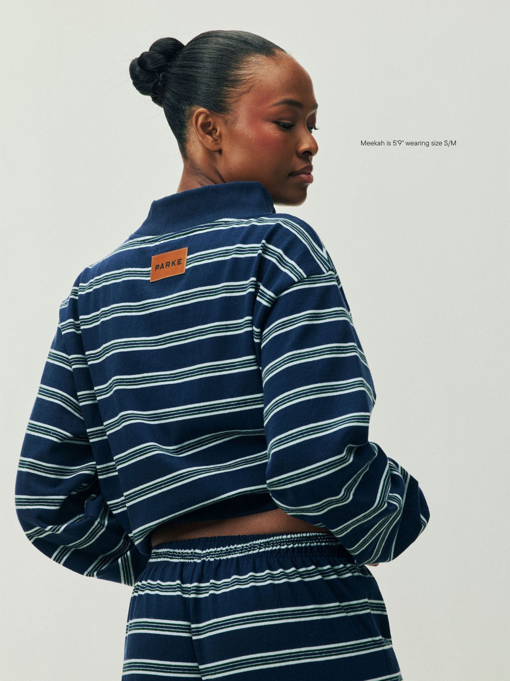 girl wearing Holiday Striped Pullover -snowflake stripe