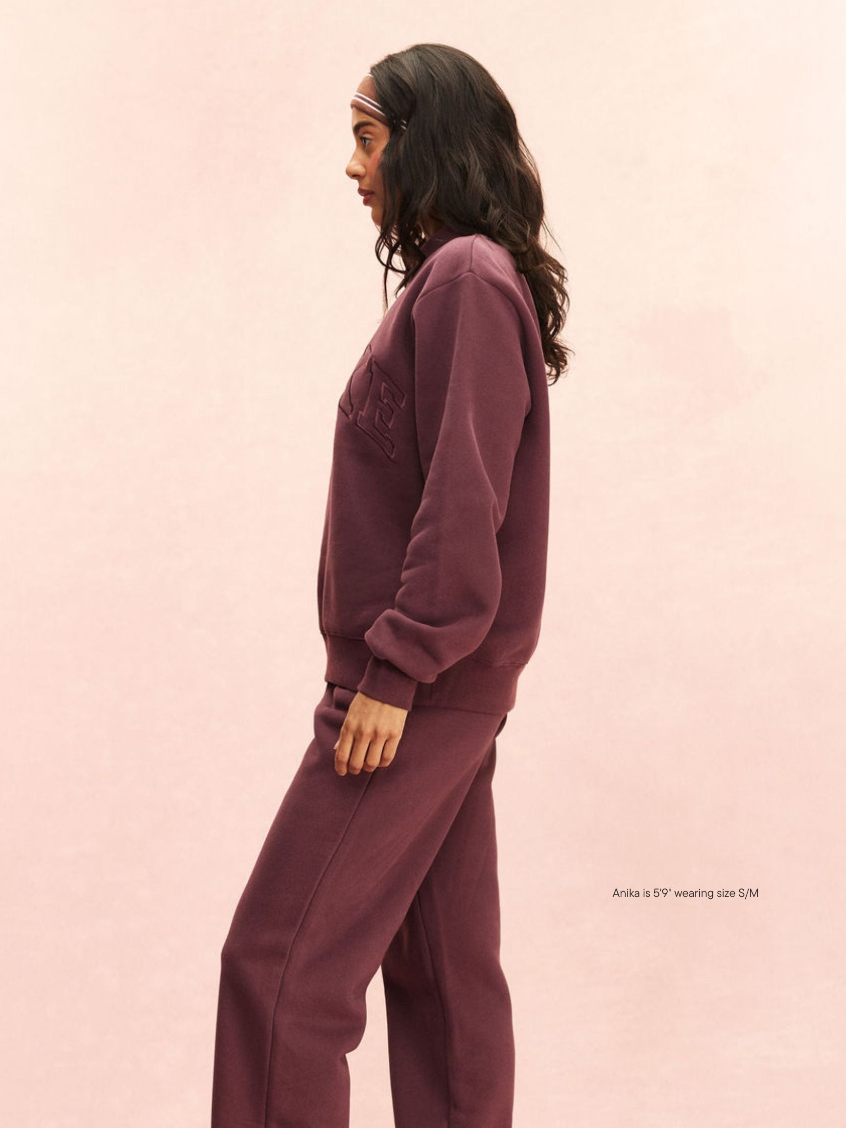 girl wearing Monochrome Varsity Mockneck -eggplant