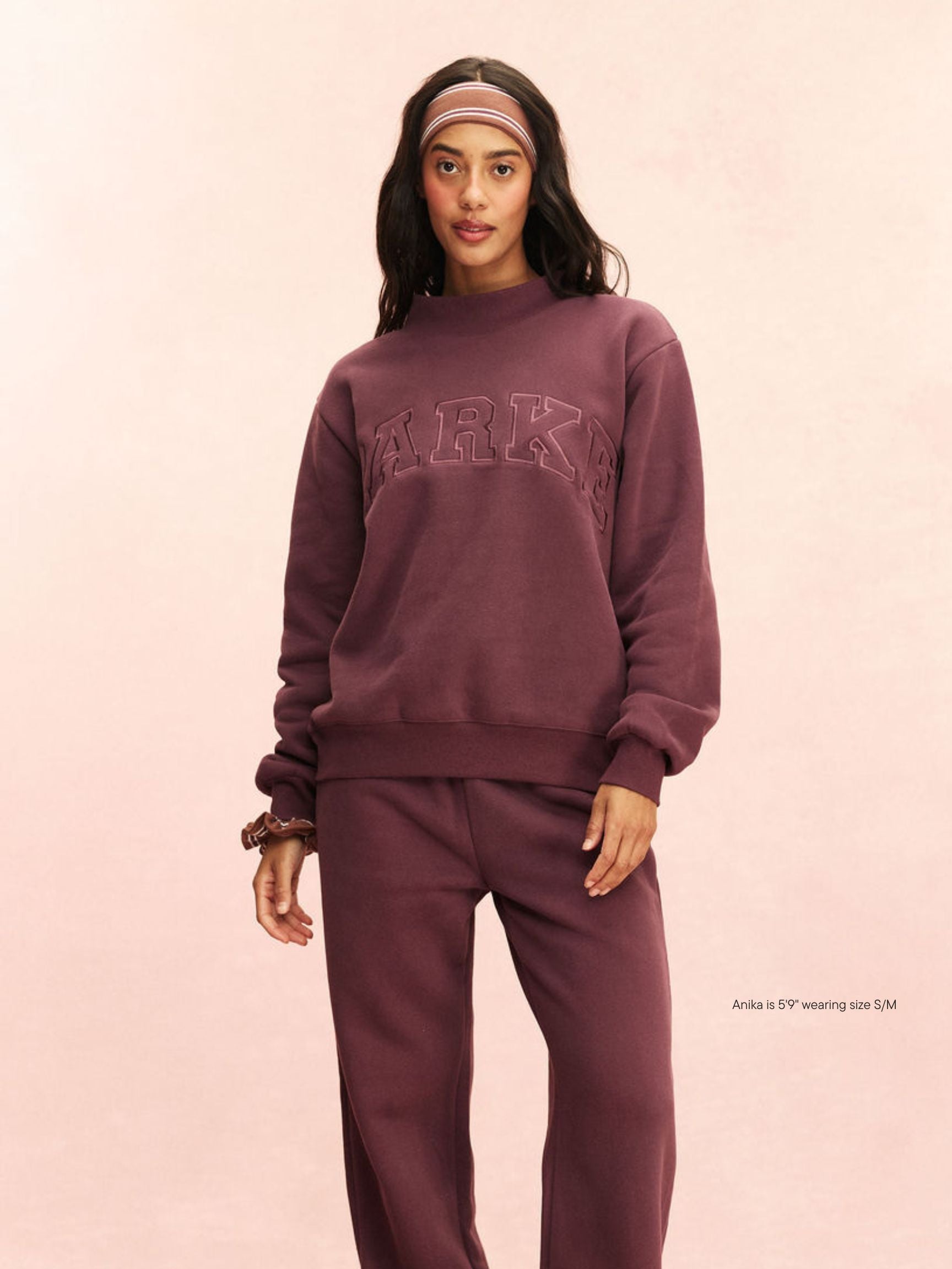 girl wearing Monochrome Varsity Mockneck -eggplant