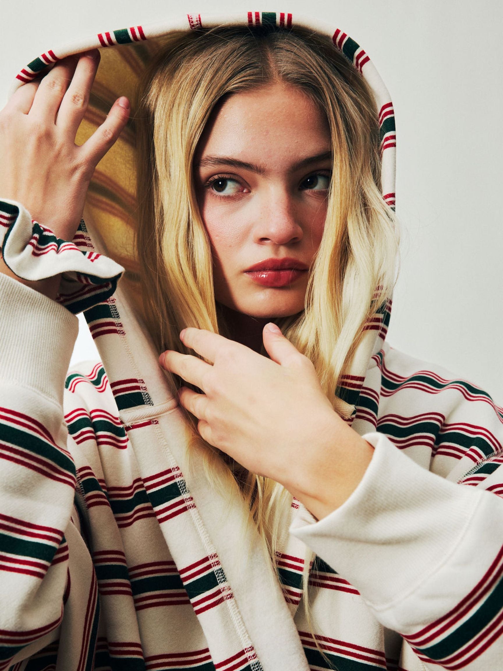 girl wearing Holiday Robe -eggnog stripe 