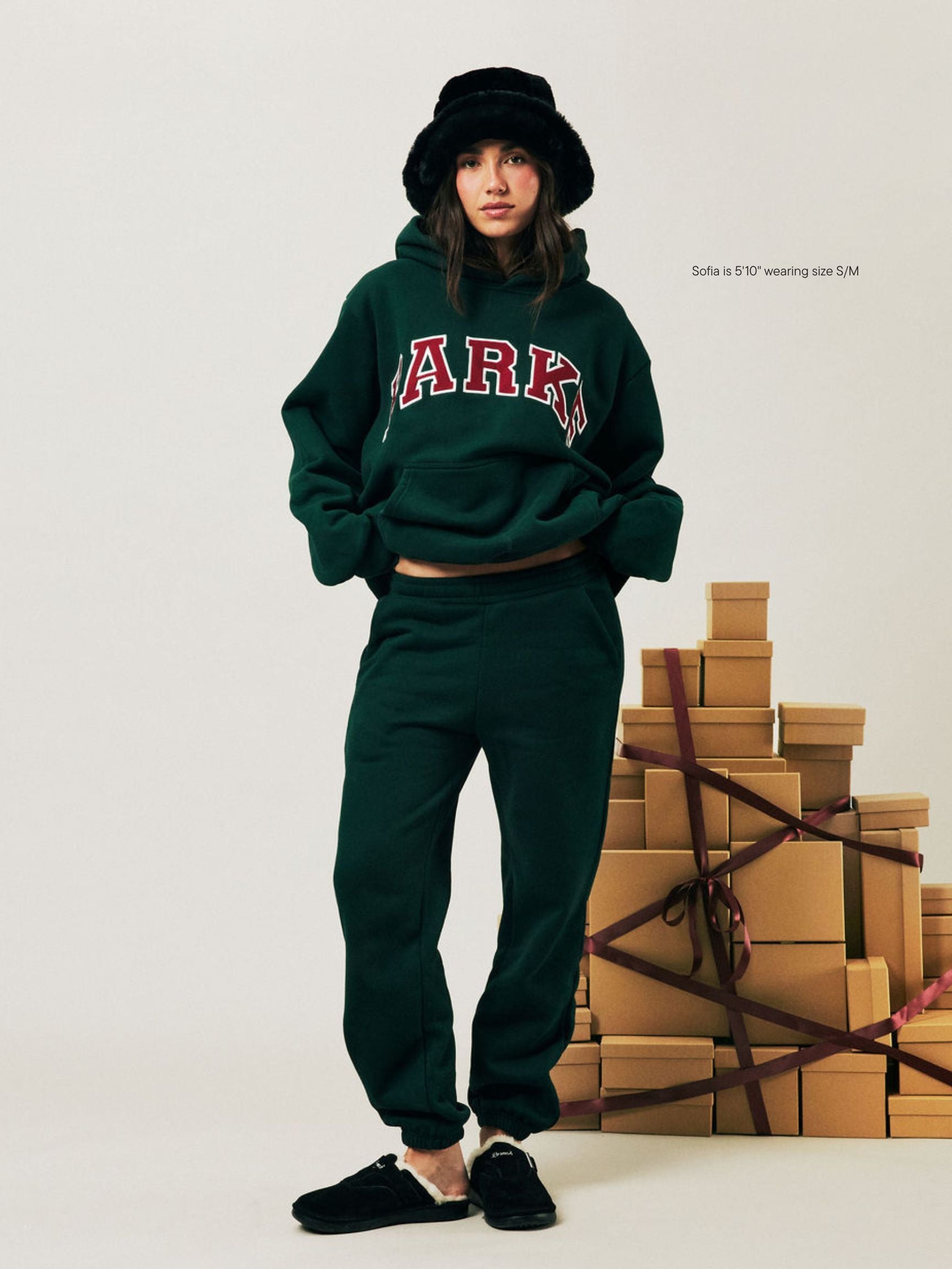 girl wearing Holiday Drawstring Unisex Sweatpants -forest