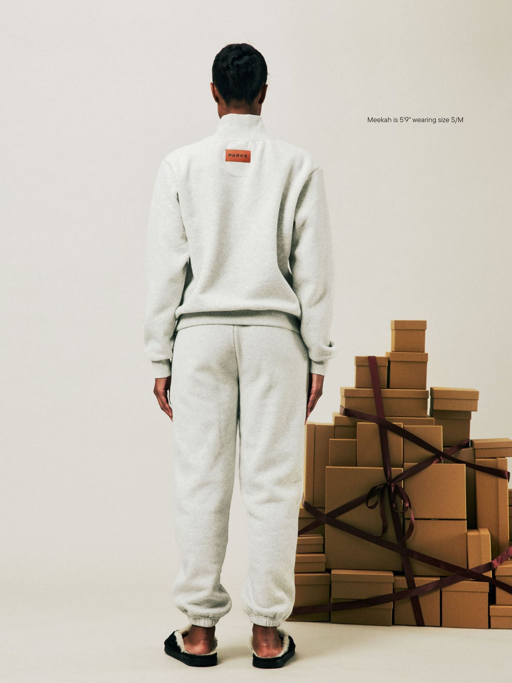 girl wearing Holiday Drawstring Unisex Sweatpants -classic grey