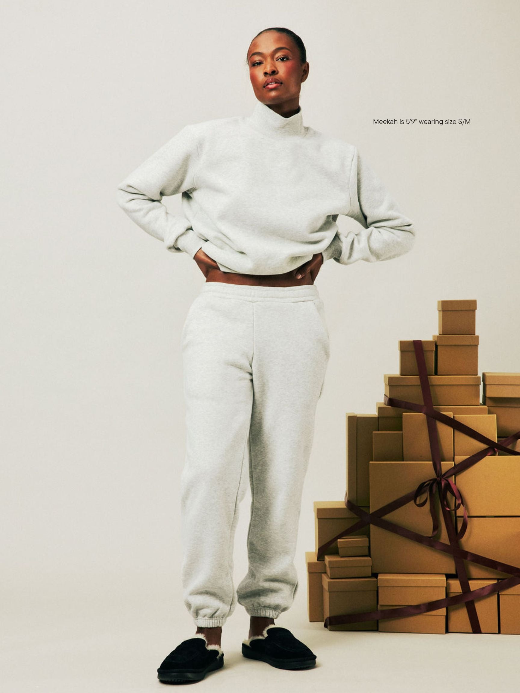 girl wearing Holiday Drawstring Unisex Sweatpants -classic grey