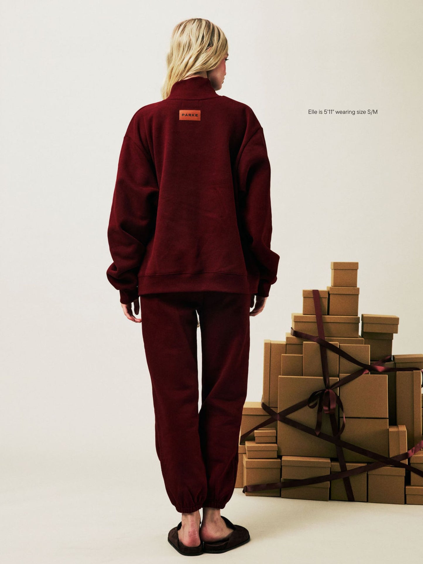 girl wearing Holiday Drawstring Unisex Sweatpants -maroon