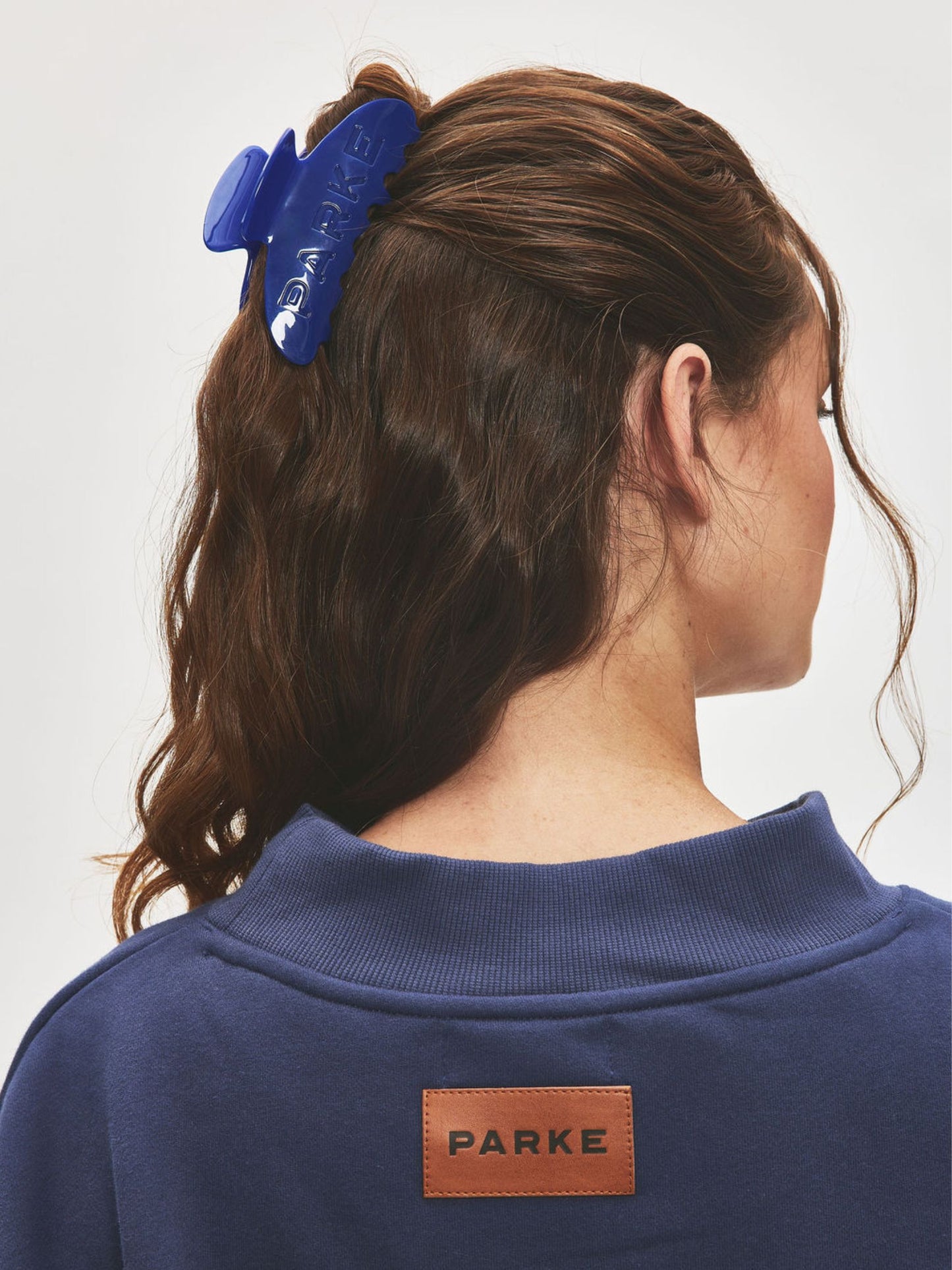 girl wearing claw clip -denim