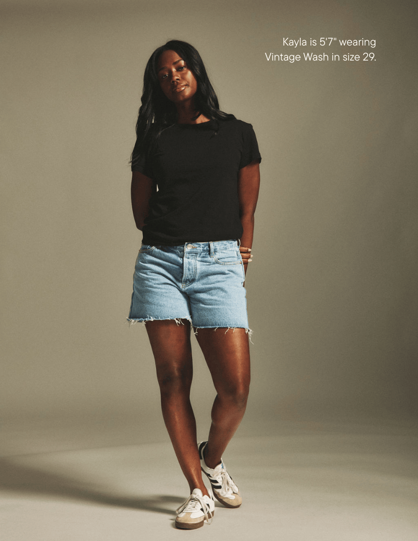 girl wearing long baggy shorts -vintage wash