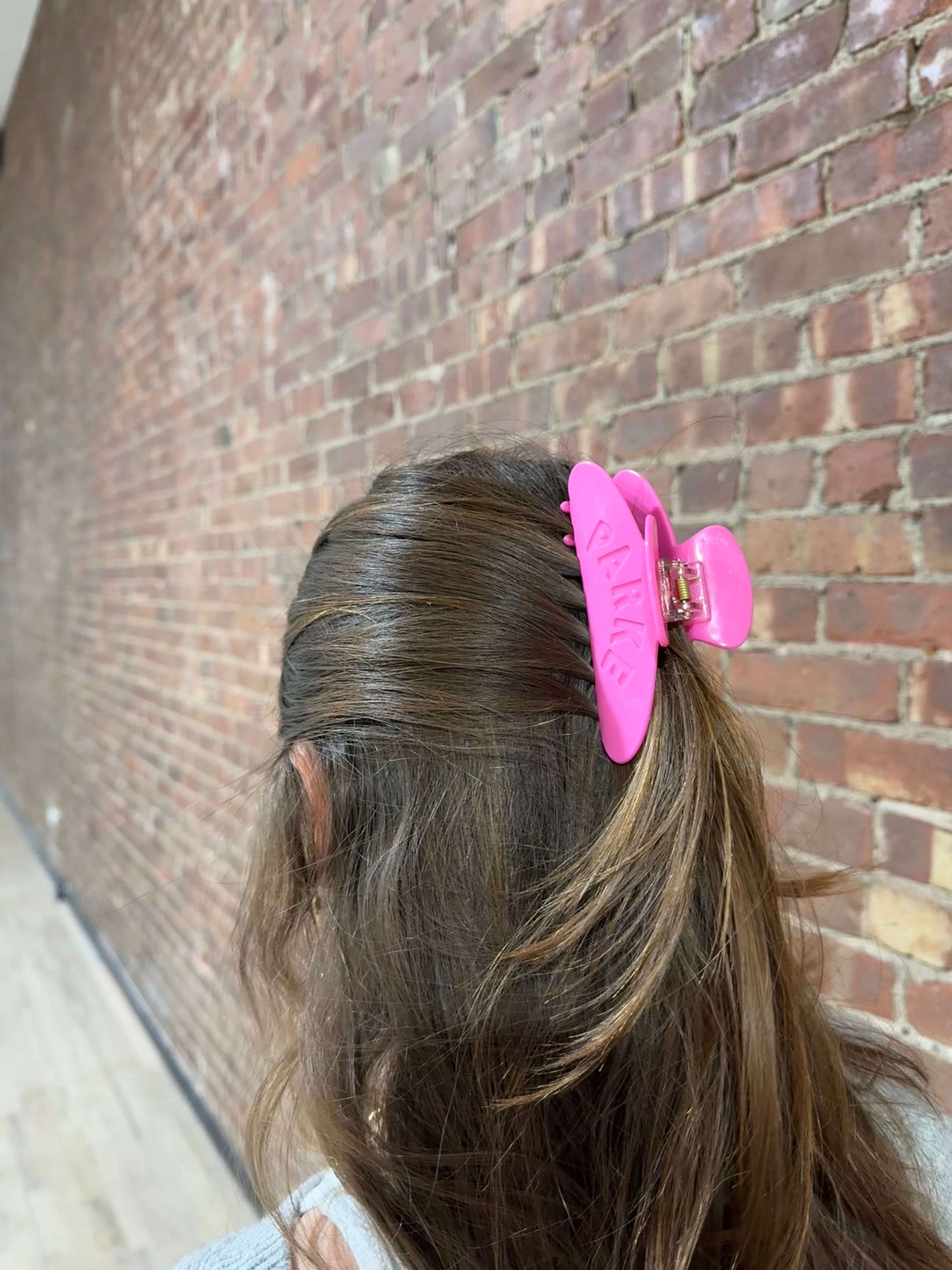 girl wearing pink claw clip -flamingo