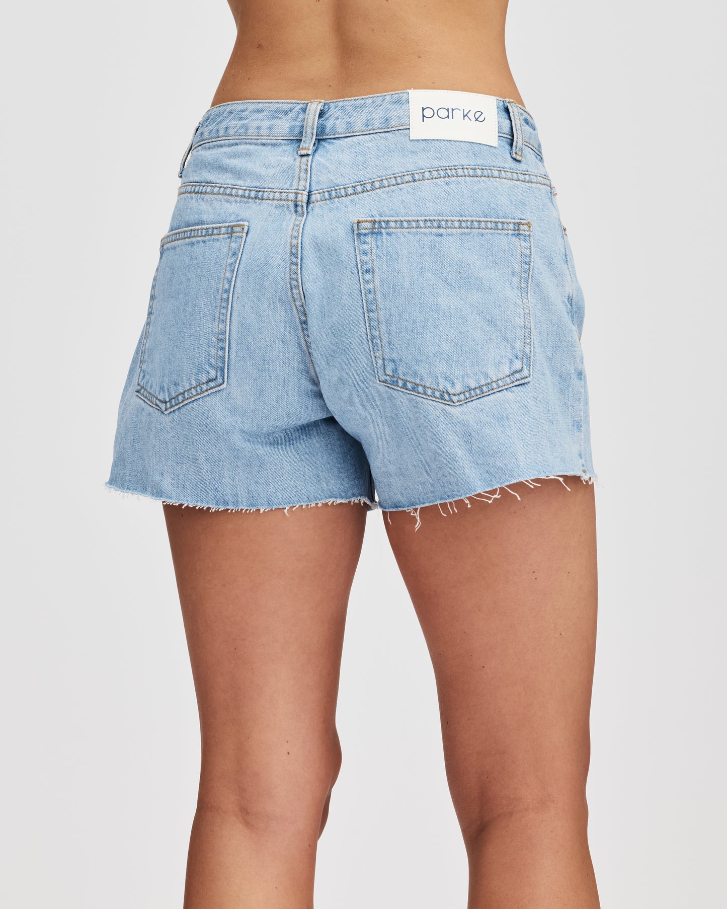 back of model wearing light was denim shorts- light wash