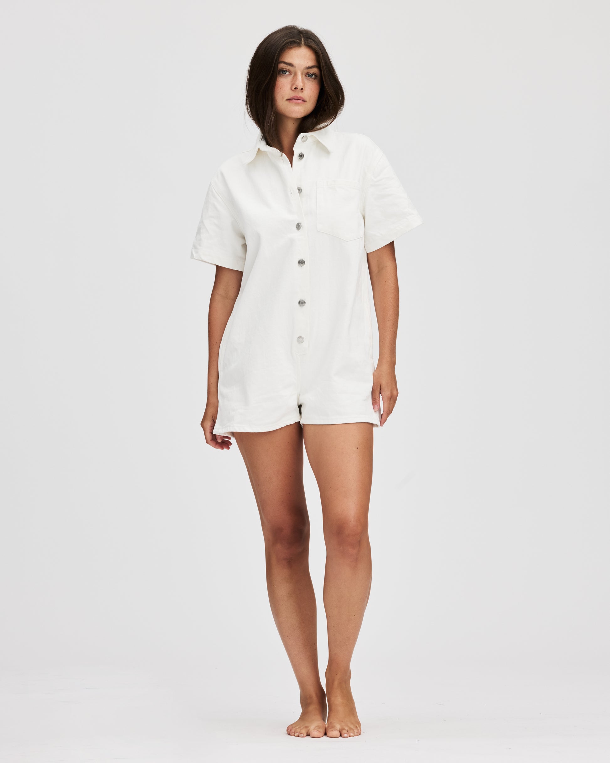 model wearing short sleeve denim romper - white