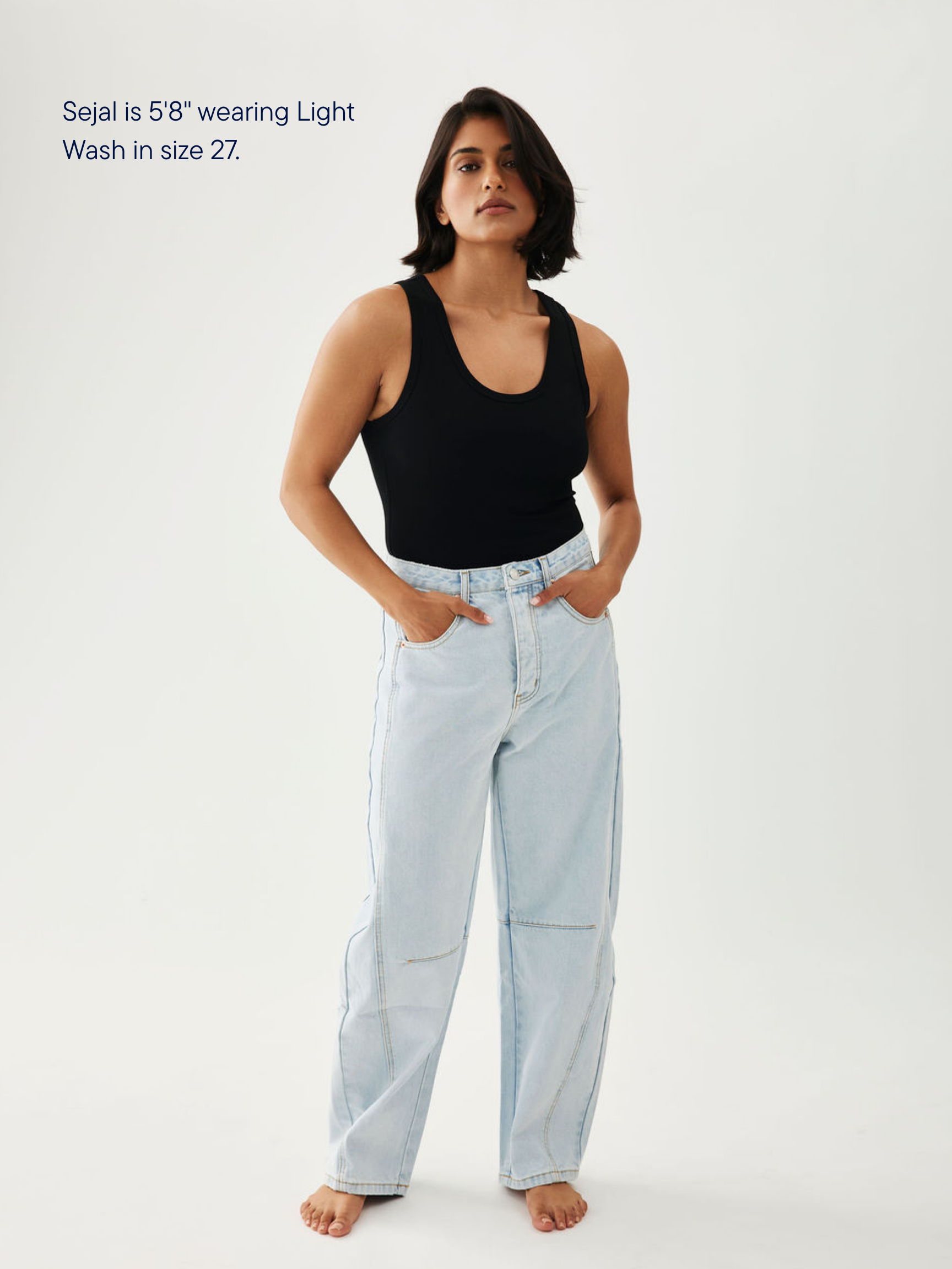 girl wearing horseshoe jeans -light wash