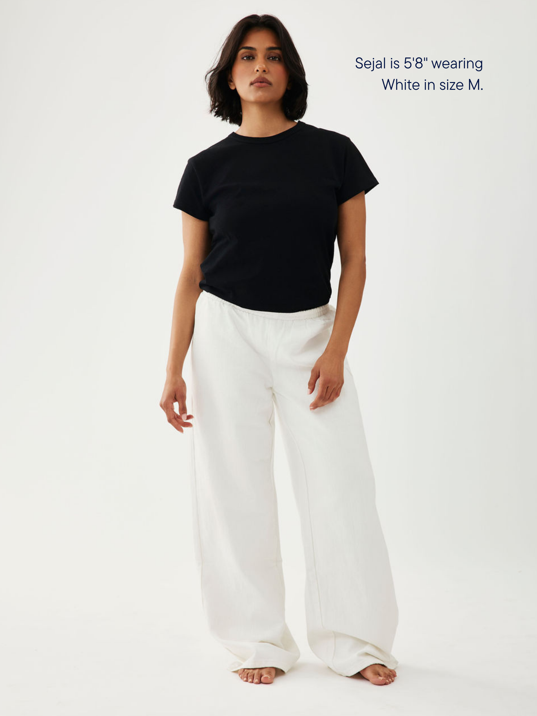 girl wearing elastic denim pant -white
