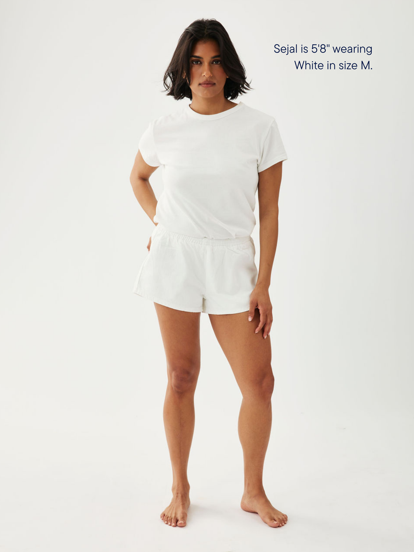girl wearing elastic denim mini short -white
