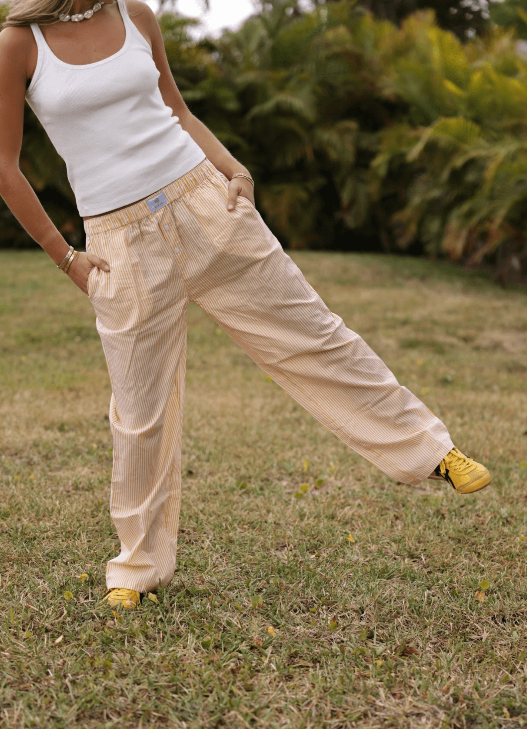 model wearing striped boxer pants - butter stripe