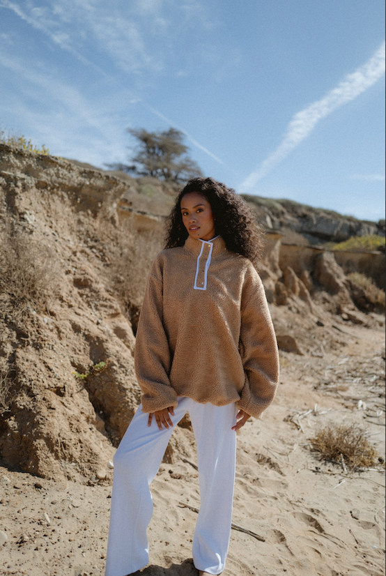 model wearing caramel fleece on the beach - caramel