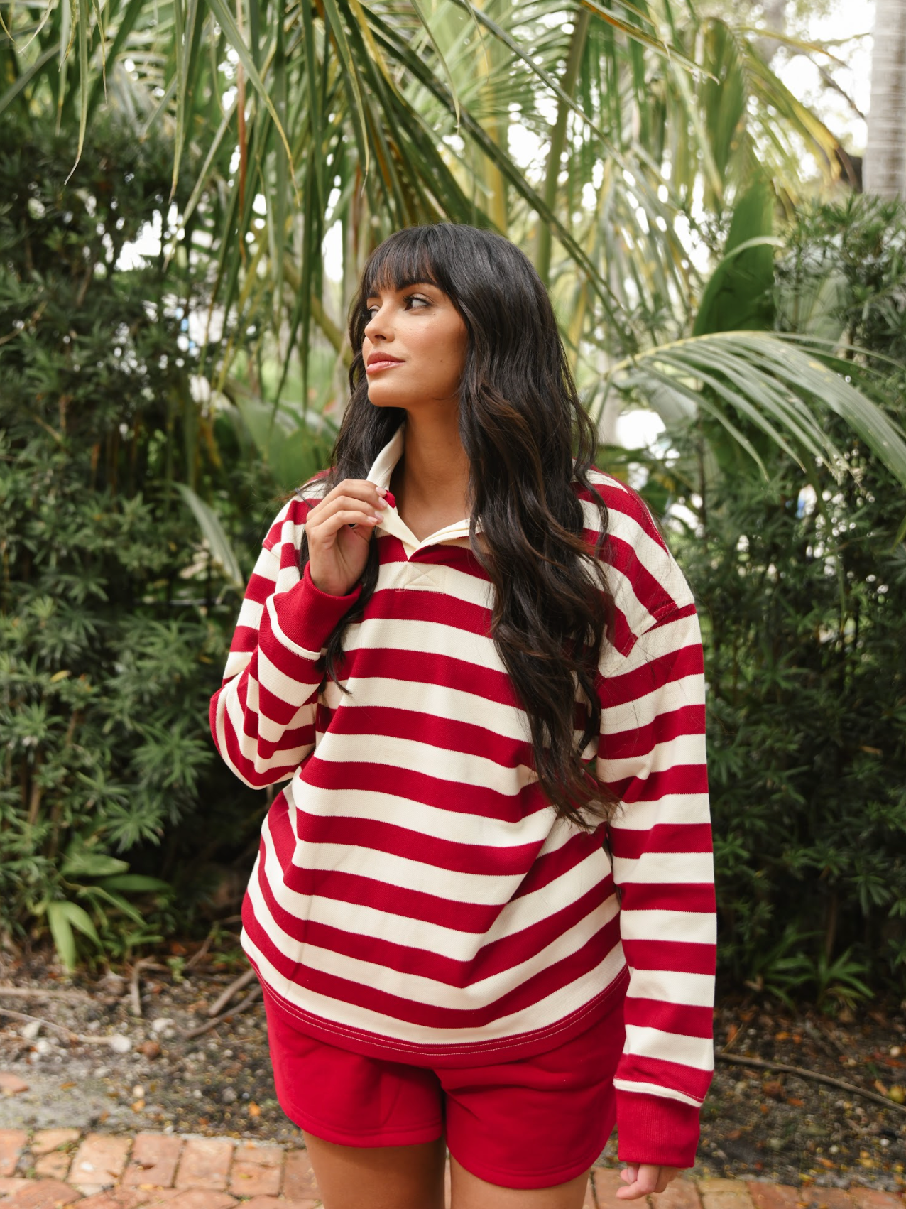 girl wearing maroon + white striped rugby- maroon + white