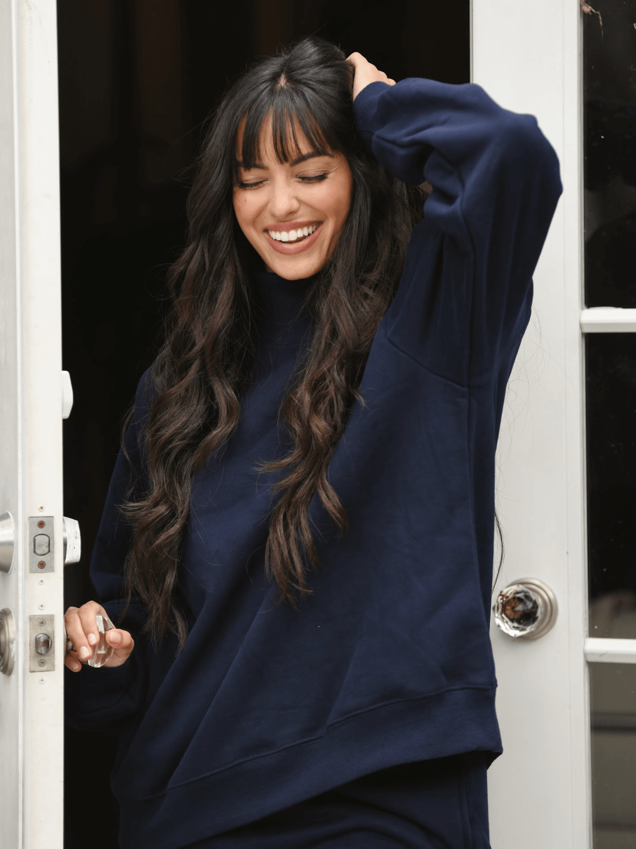 model wearing turtleneck sweatshirt - navy