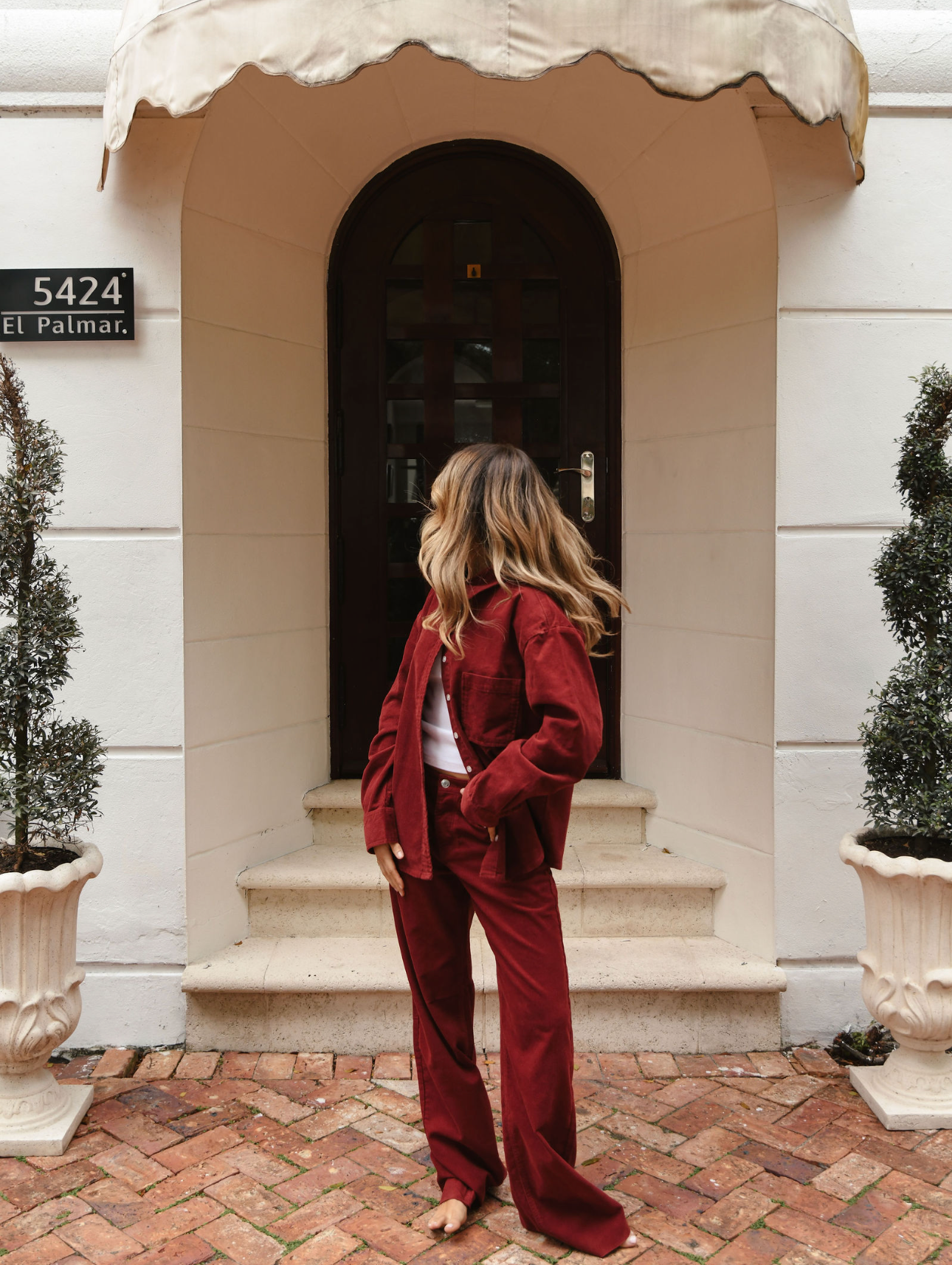 girl wearing burgundy low rise baggy pant- burgundy