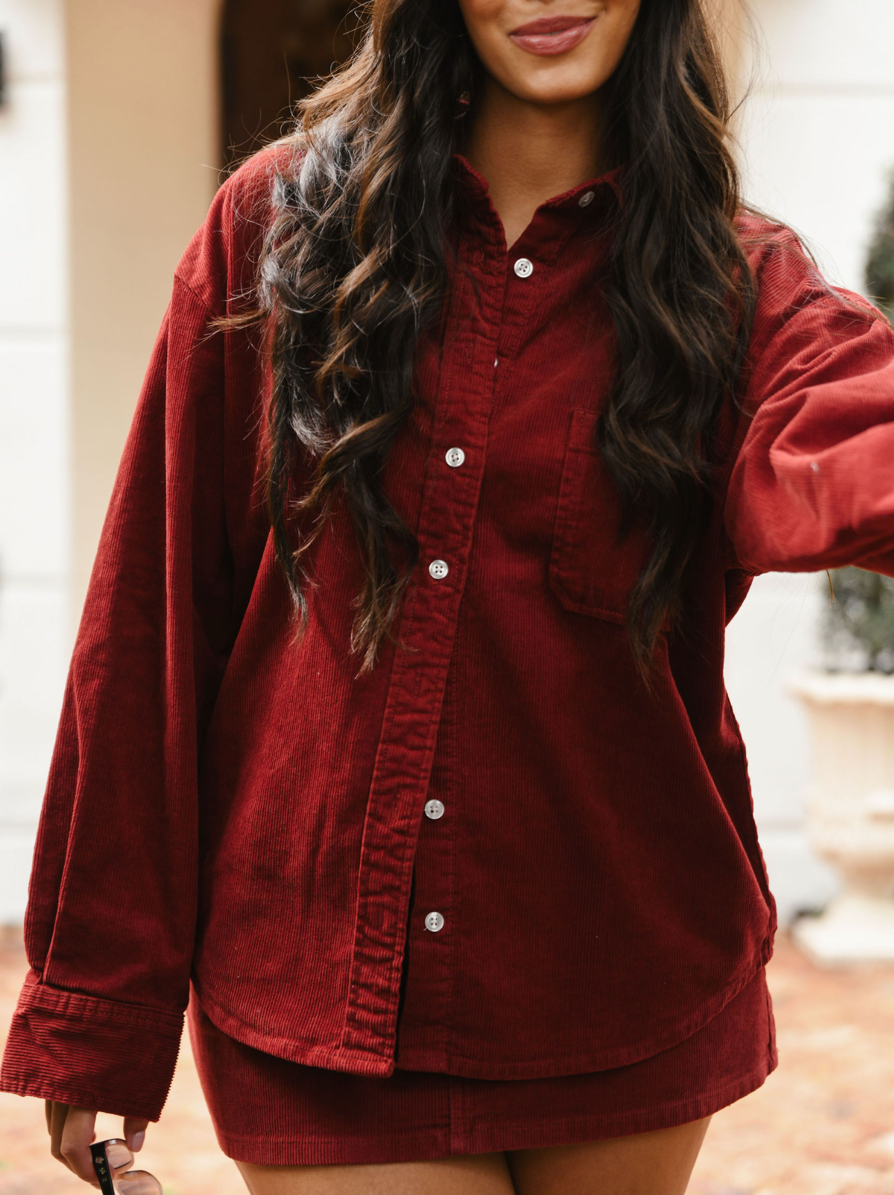 girl wearing burgundy cord shirt- burgundy