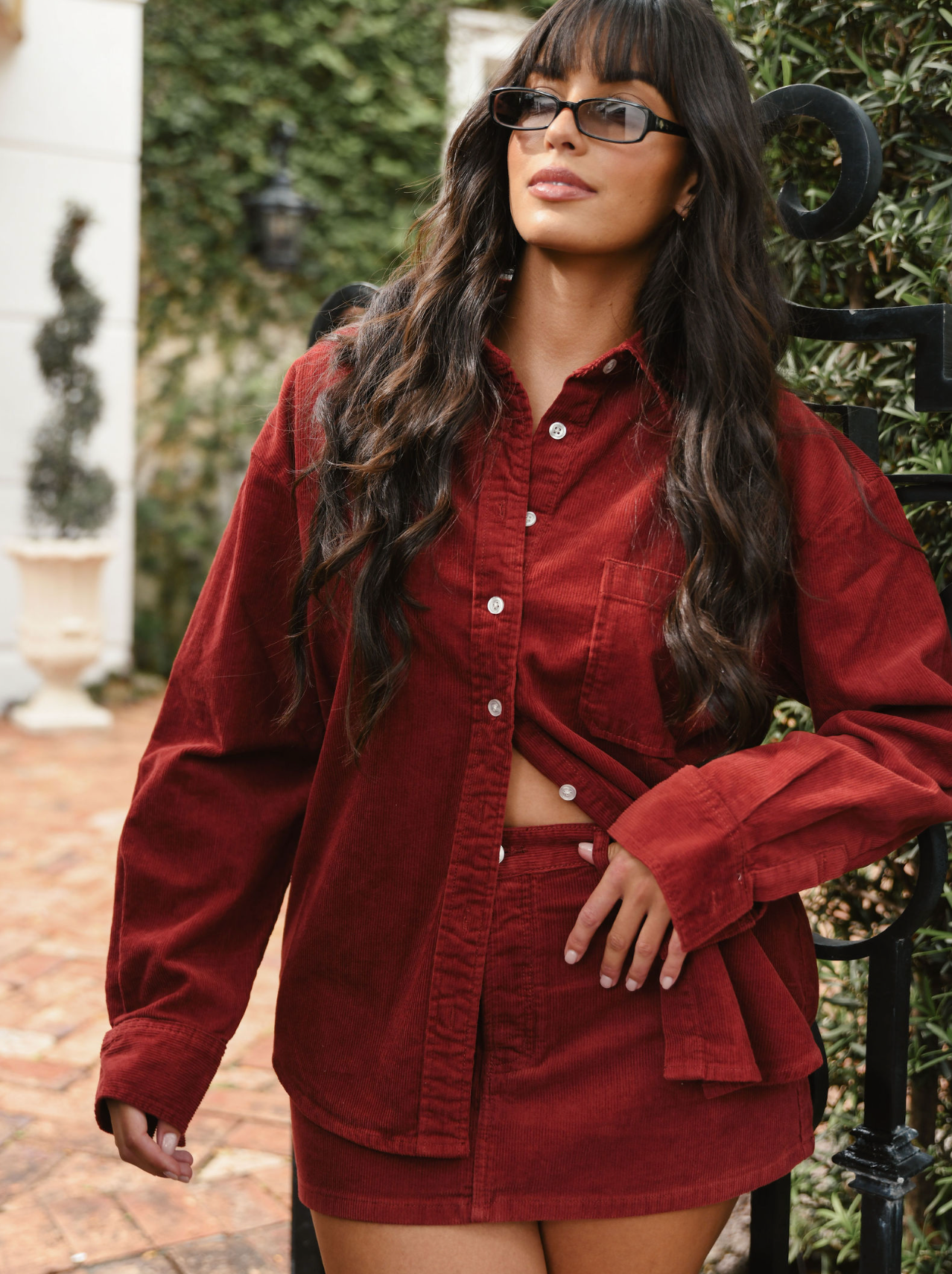 girl wearing burgundy cord shirt- burgundy