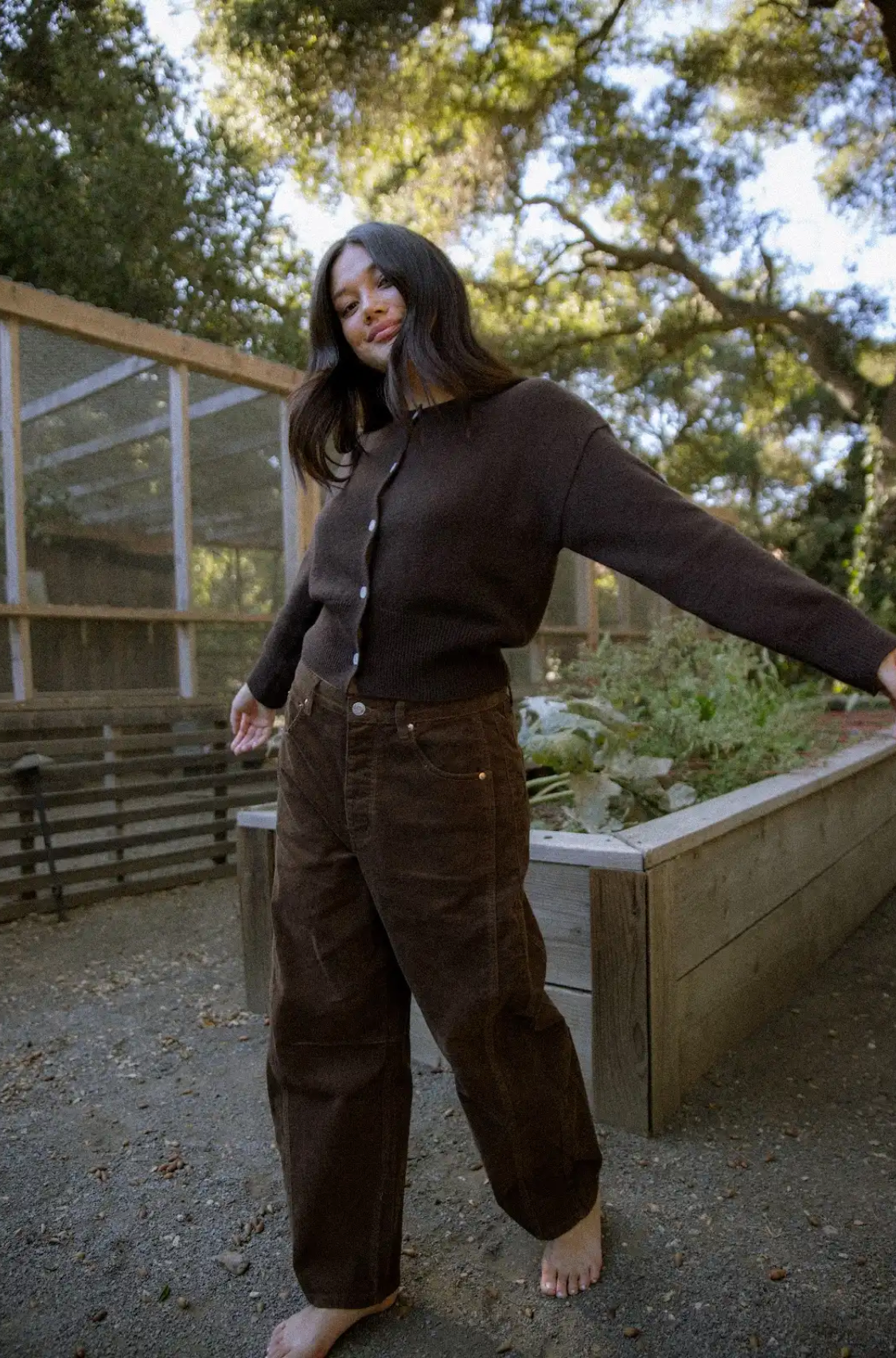 girl wearing chocolate brown cord horseshoe pant- chocolate brown