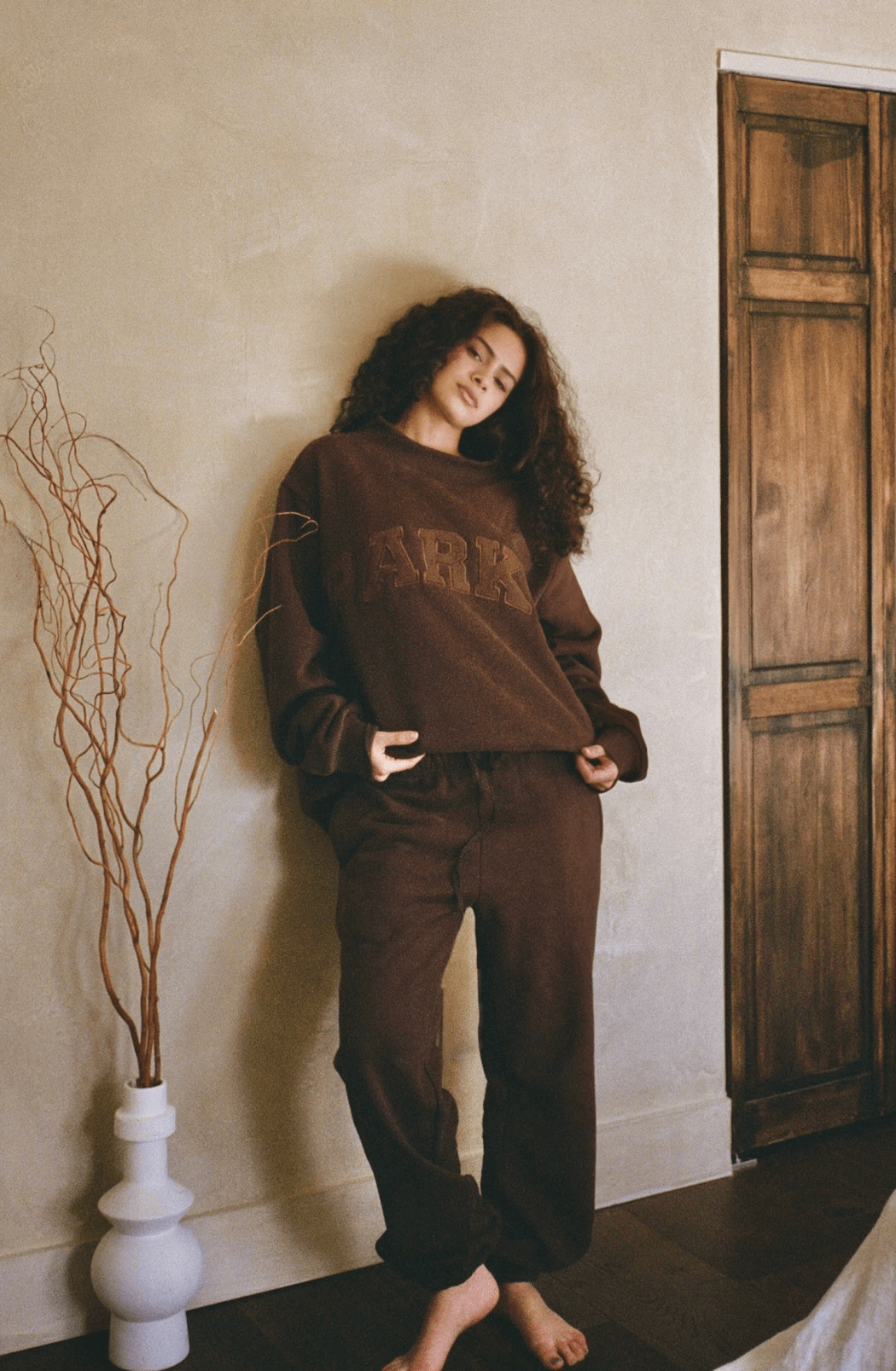 model wearing unisex sweats - chocolate