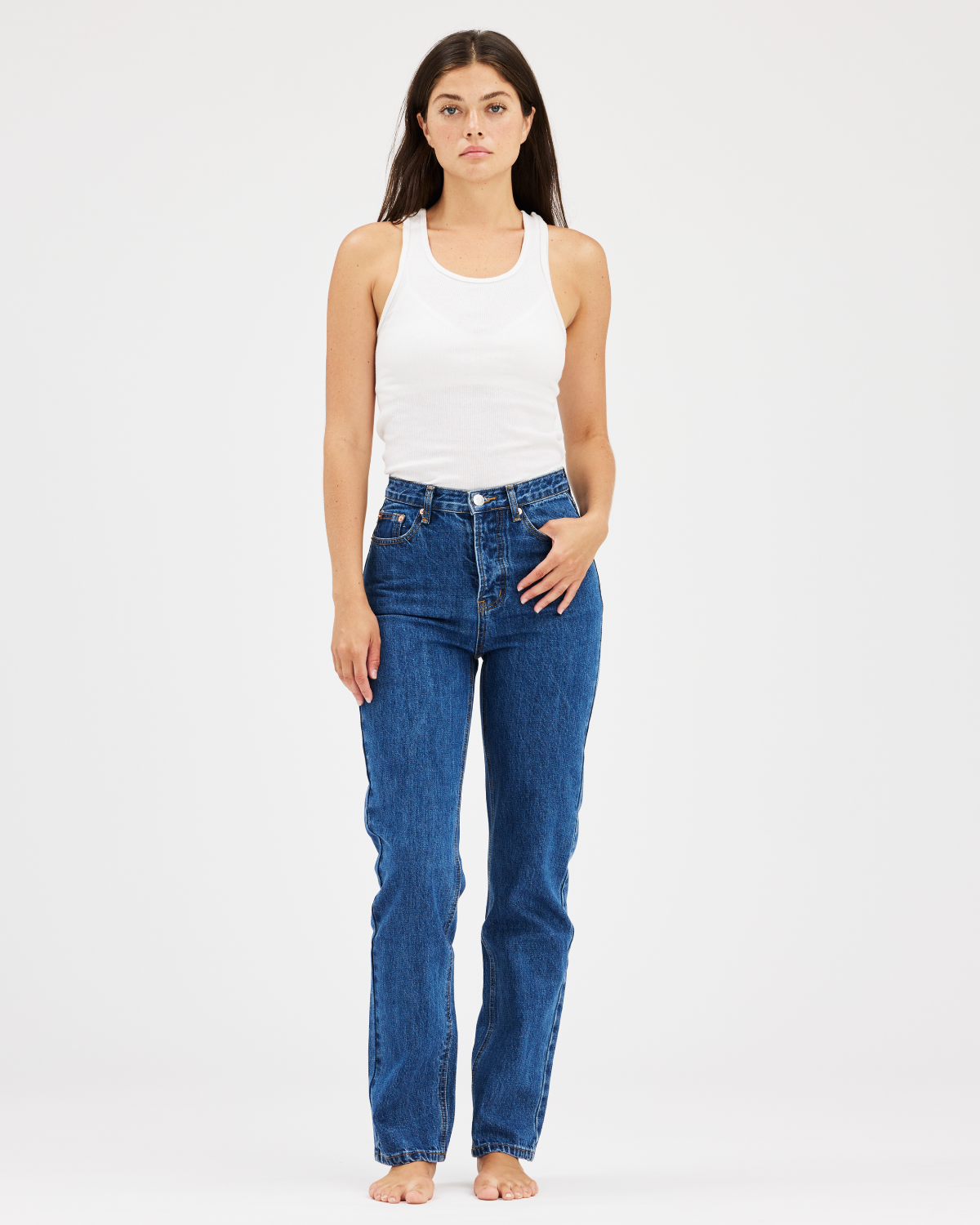 Full body view of a model wearing the 90s straight jean in medium wash -med wash