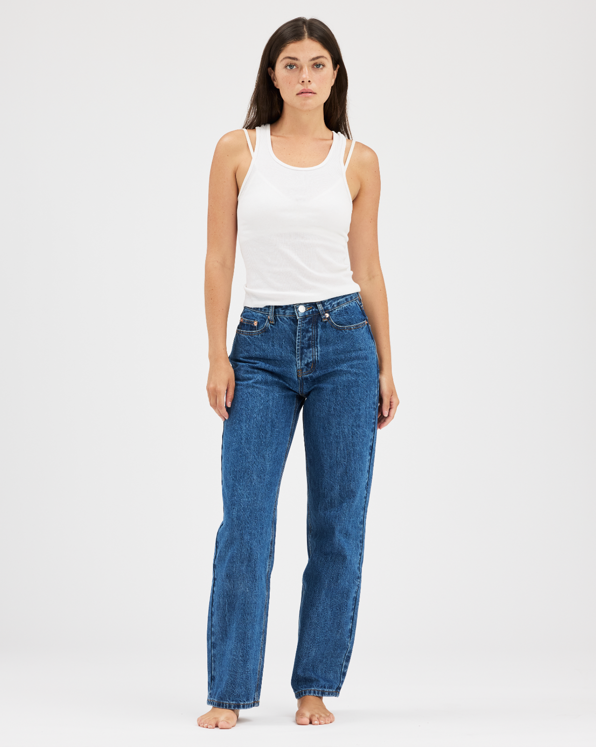 girl wearing med wash classic straight jean- med wash