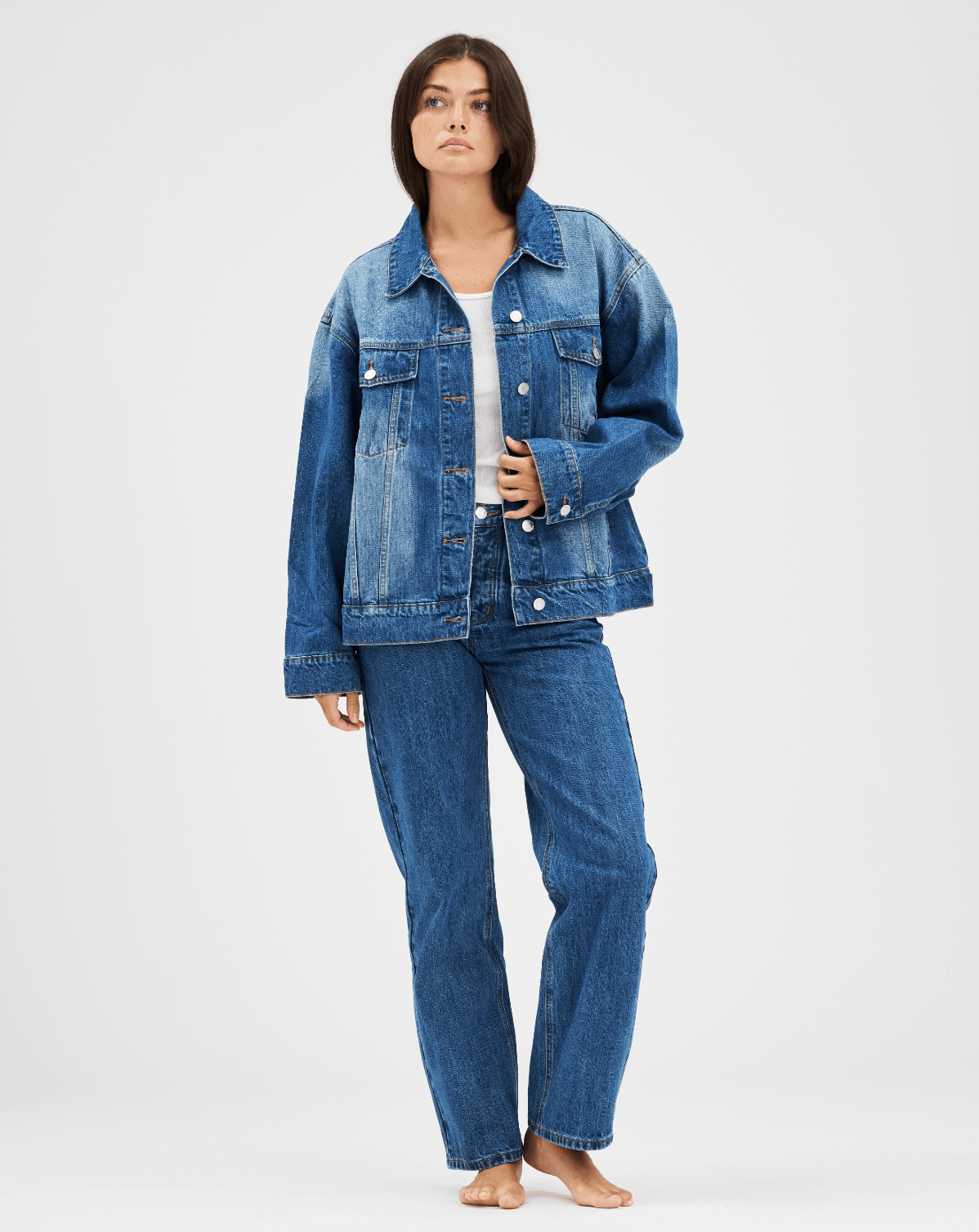 girl wearing med wash oversized jean jacket -med wash