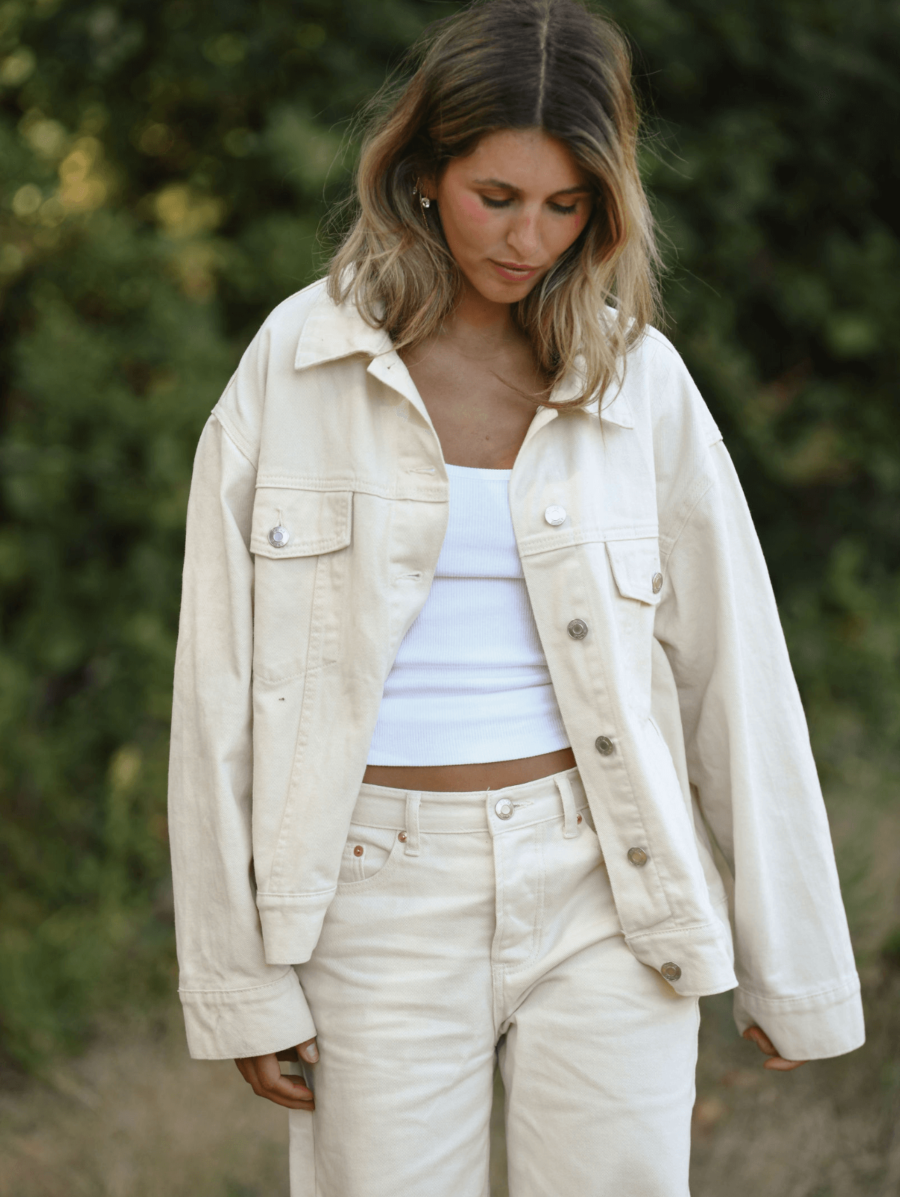 girl wearing cream oversized jean jacket -cream