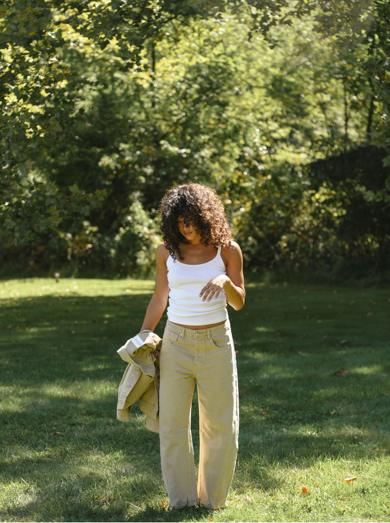 model wearing camel horseshoe jean - camel