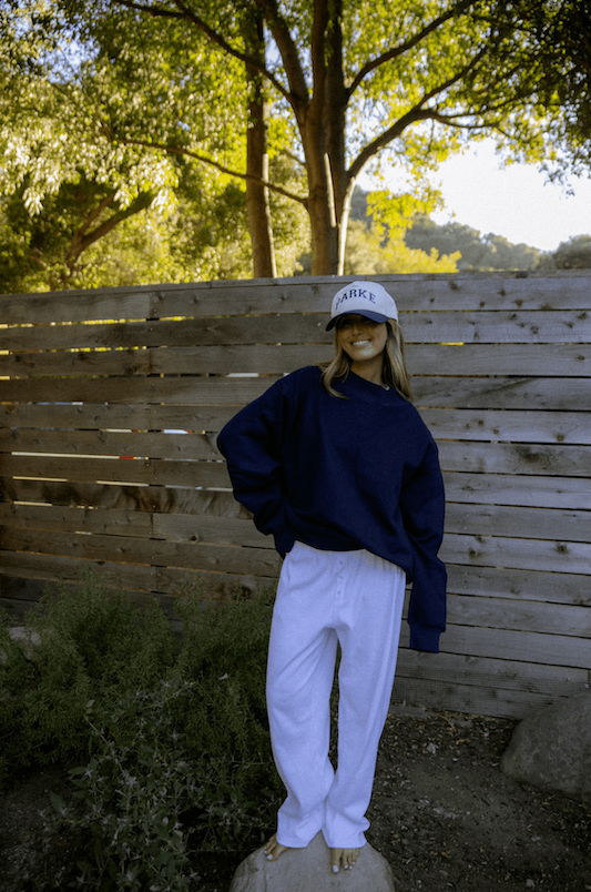 model wearing varsity trucker hat - navy