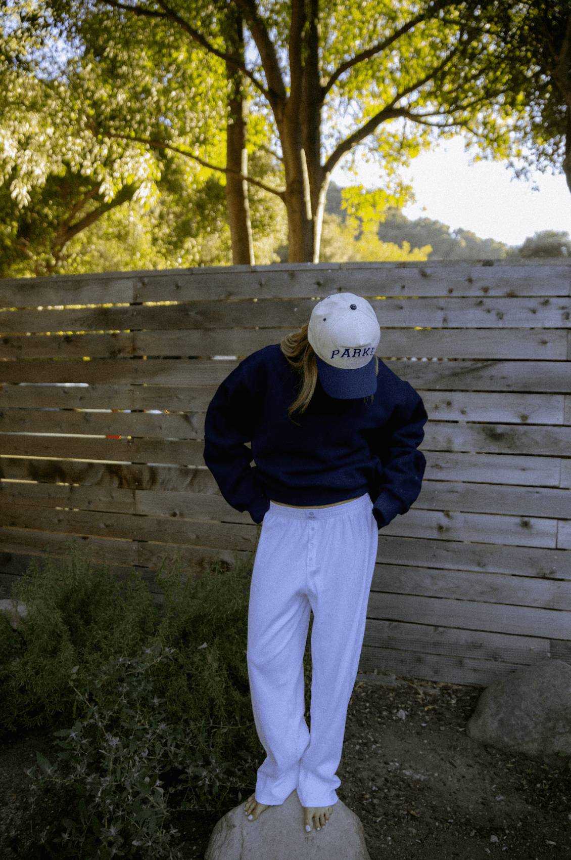 model wearing varsity trucker hat - navy