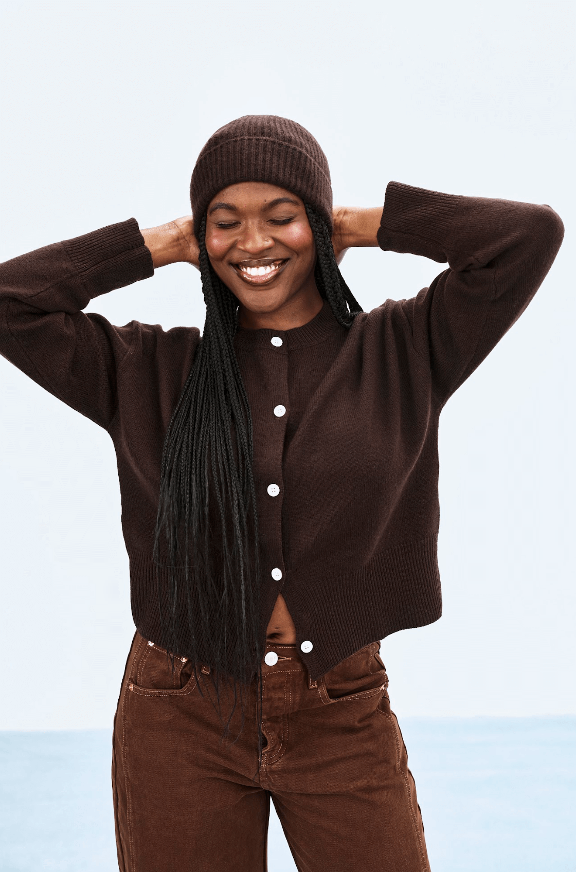 girl wearing chocolate cardigan and hat -  chocolate