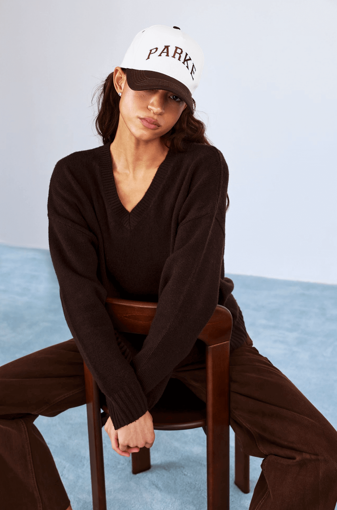 model wearing v neck sweater -chocolate