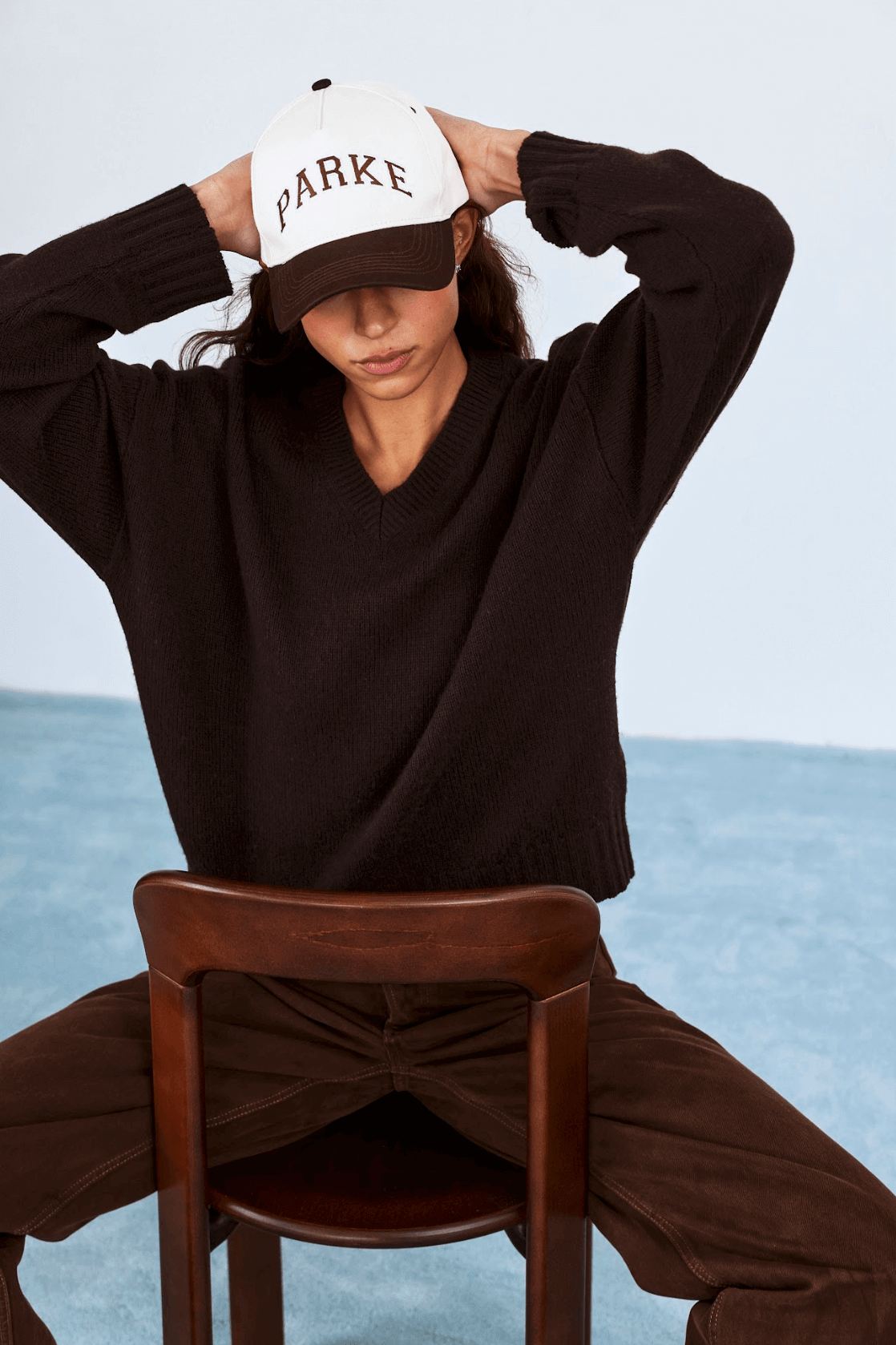 model wearing v neck sweater -chocolate